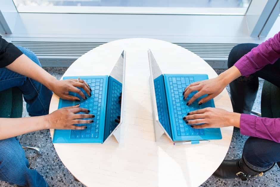 A group of people working on laptops, symbolizing digital marketing