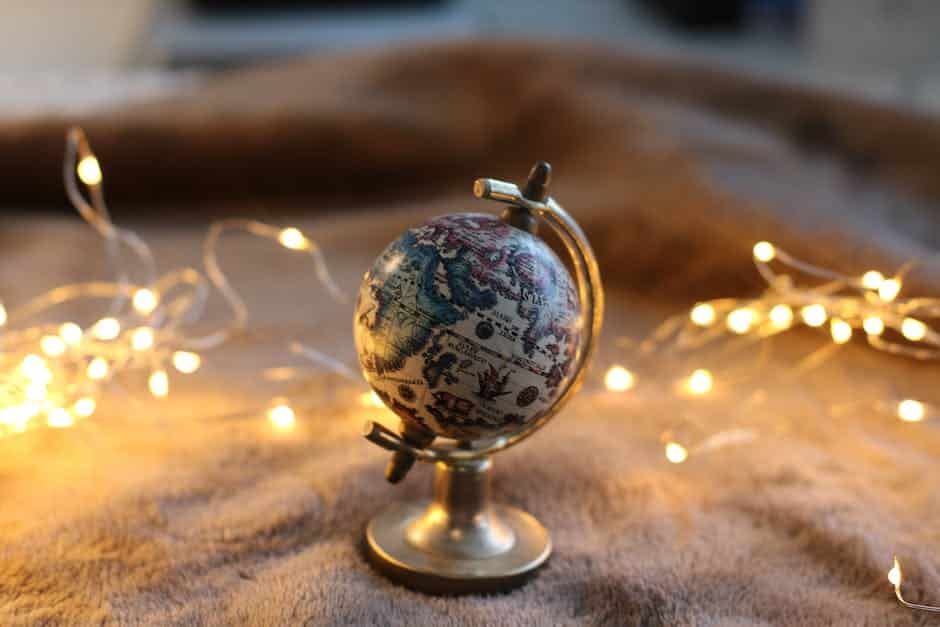 An image of a person holding a globe, representing the global understanding and cultural empathy associated with understanding the various forms of English